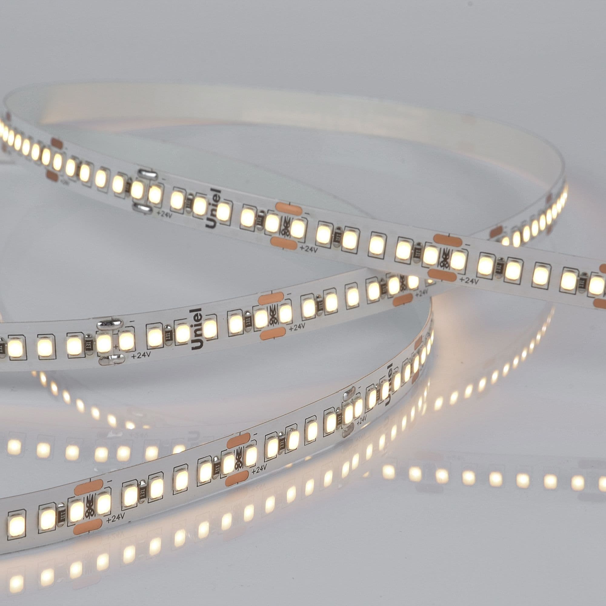 Лента светодиодная гибкая на самоклеящейся основе. ULS-2835-180LED/m-10mm-IP20-DC24V-17W/m-5M-3000K Катушка 5м. в герметичной упаковке. Теплый белый свет(3000К)